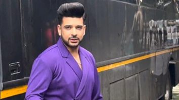 Karan Kundrra waves at paps as he gets clicked on a set