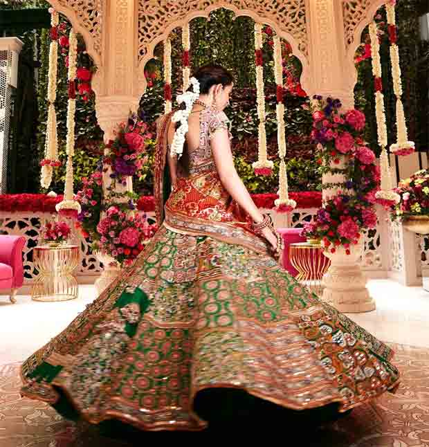 Shloka Mehta exudes elegance in custom Anamika Khanna resham lehenga with gota patti borders and dupatta draped in Gujarati-style saree pallu