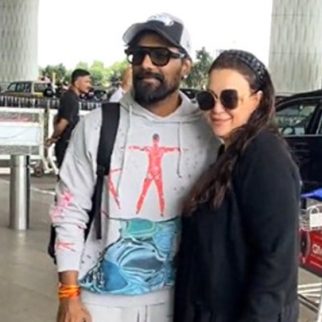 Comfy airport look done right! Remo D'Souza with wife Lizelle