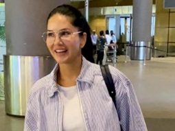 Sunny Leone greets paps with a smile at the airport