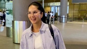 Sunny Leone greets paps with a smile at the airport