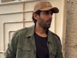 Kartik Aaryan strikes a pose for paps in his cool outfit as he gets clicked