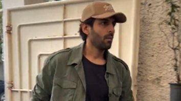 Kartik Aaryan strikes a pose for paps in his cool outfit as he gets clicked