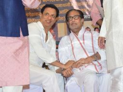 Madhur Bhandarkar poses in all white at an event