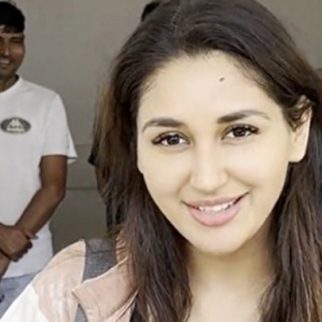 Nikita Dutta cutting cake with paps post her gym session