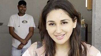 Nikita Dutta cutting cake with paps post her gym session