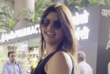 Akanksha Puri dances with a pap on the airport