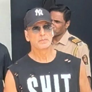 Akshay Kumar in a cool sando which says SHIT HAPPENS