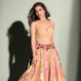 Sophie Choudry redefines Bridal elegance in a stunning yellow and pink lehenga