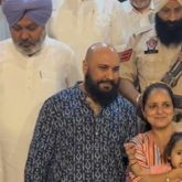B Praak poses with fans as he gets clicked by paps