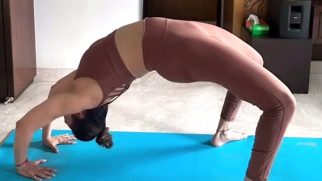 Isha Koppikar practicing her rhythmic yoga
