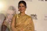 Nimrat Kaur in a beautiful golden saree