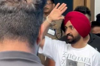 Diljit paji waves to the paps at the airport