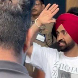 Diljit paji waves to the paps at the airport