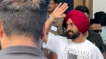 Diljit paji waves to the paps at the airport