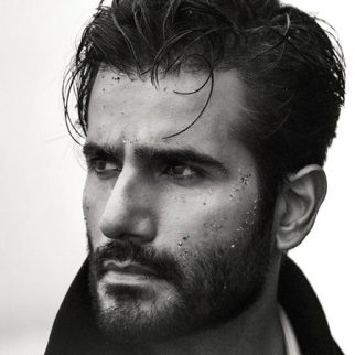 Karan Tacker sets the shore on fire in dreamy Trench Coat shoot; fans call him a ‘storm in stillness’
