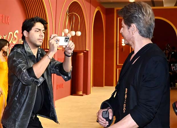 Aryan Khan becomes photographer as Shah Rukh Khan strikes a pose with paparazzi at The Bads of Bollywood premiere 