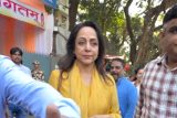 Hema Malini flashes a warm smile while proudly showing her inked finger