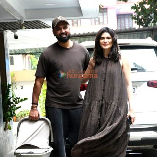 Photos: Karishma Tanna snapped with her husband and her newborn child as she returns to her home in Bandra